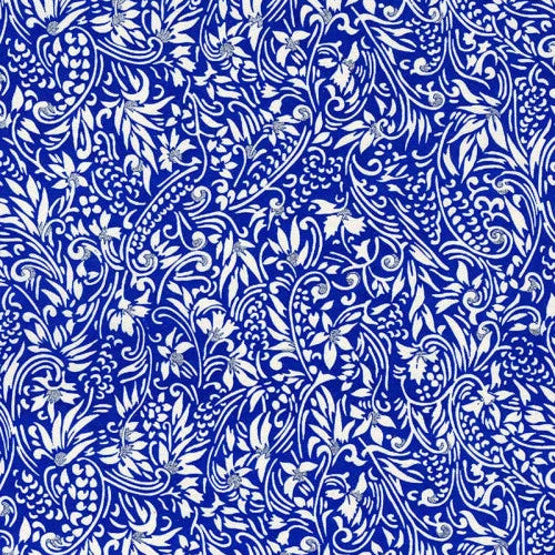 Japanese screen printed decorative chiyogami paper used in handmade cards. A repeating blue and white ornamental floral and paisley pattern with silver highlights.