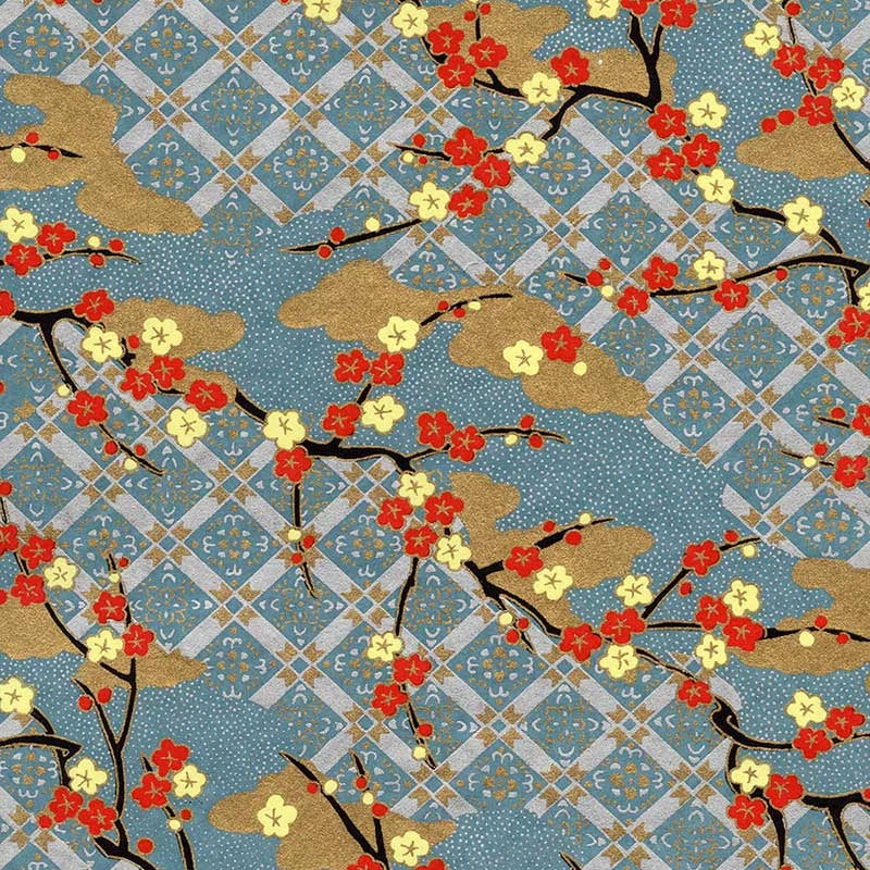Japanese silk screen printed decorative chiyogami paper used on handmade cards. Japanese-style floral pattern featuring red and white cherry blossoms on branches over a blue geometric lattice background with gold clouds.