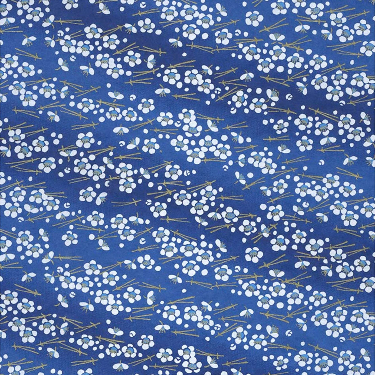 Jaoanese screen printed chiyogami decorative paper patterned with dense white cherry blossoms on a royal blue background and thin branch details.