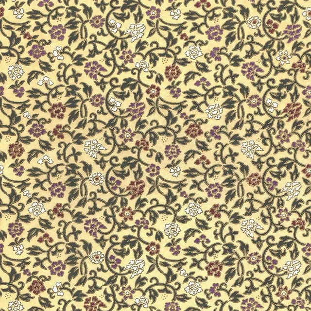 Japanese screen printed decorative chiyogami paper used in handmade cards. A repeating floral pattern on a pale yellow background, featuring dark green vines and leaves with small purple and white blossoms.