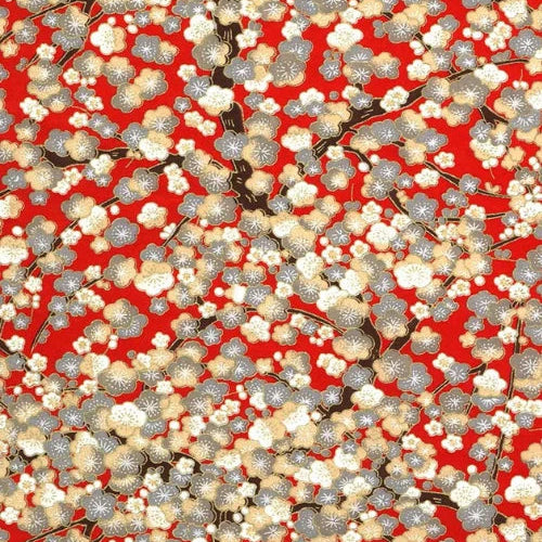 Japanese screen printed decorative chiyogami paper used in handmade cards. Floral pattern with white and gray flowers on a red background and hints of gold.