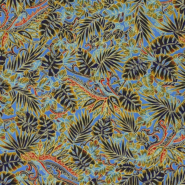 Japanese screen printed decorative chiyogmai paper used in handmade cards. A repeating tropical leaf pattern in blue, olive green, black, and orange, resembling monstera and palm leaves with ornate vine details. 